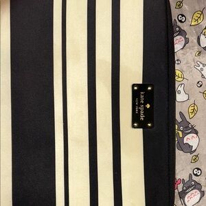 Kate Spade ♠️ New York Black and Cream striped laptop sleeve. Call outs.